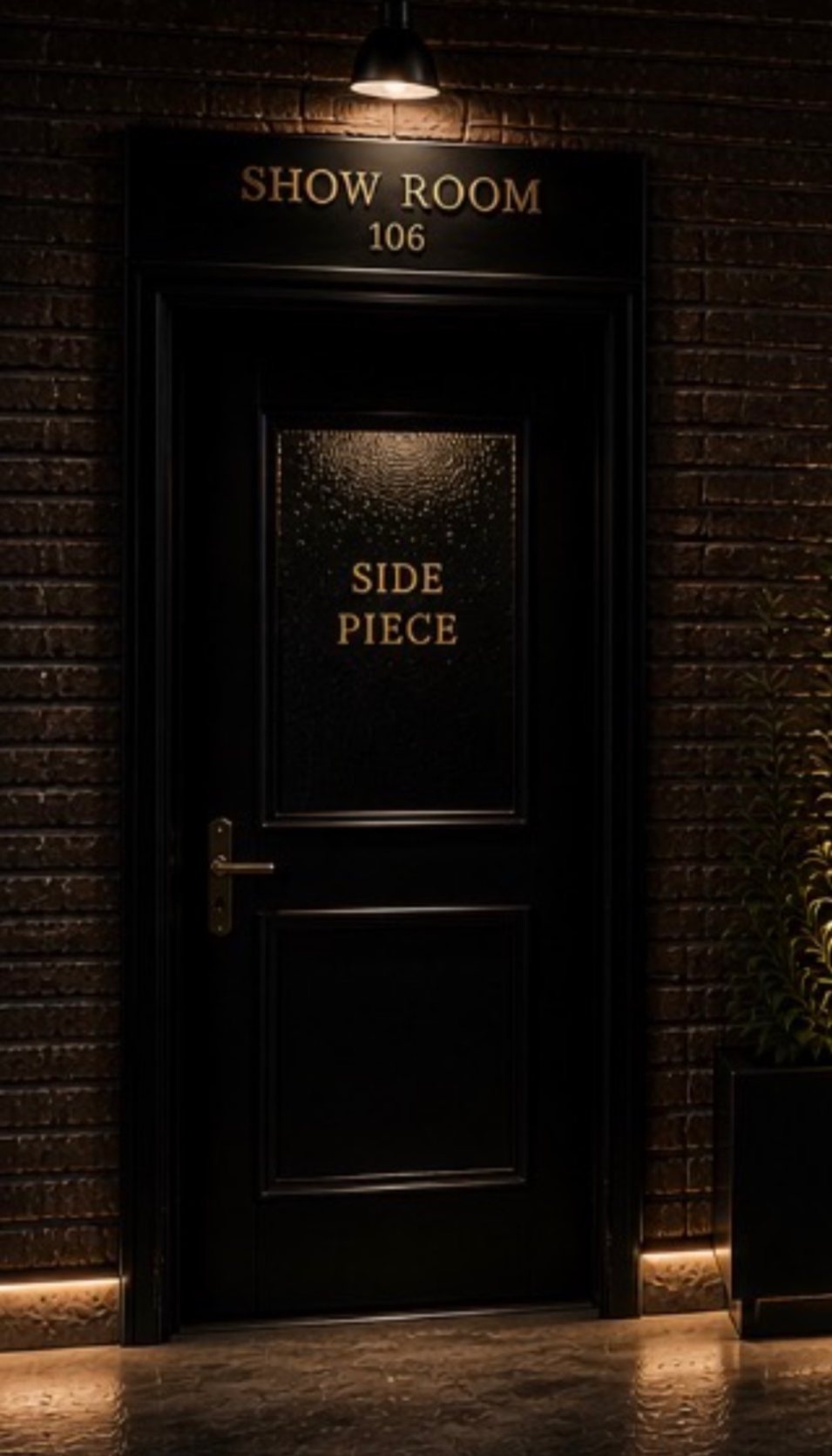 Rendering of the Side Piece show room door: a black door with a brass handle and a small sign, set in dark brick.